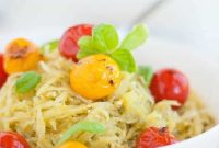 Whole30 Baked Spaghetti Squash with Pesto and Burst Tomatoes