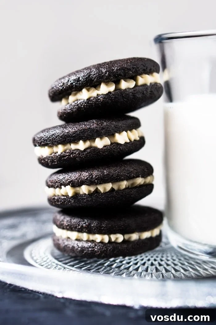 15-Minute Cookies ’N Cream Milkshake — Gluten-Free, Dairy-Free, Keto 3 Gluten free & keto oreos stacked with a glass of milk