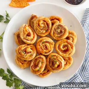Ham and Cheese Crescent Roll-Ups Baked to Golden Perfection 8 ham and cheese crescent roll ups on a white platter
