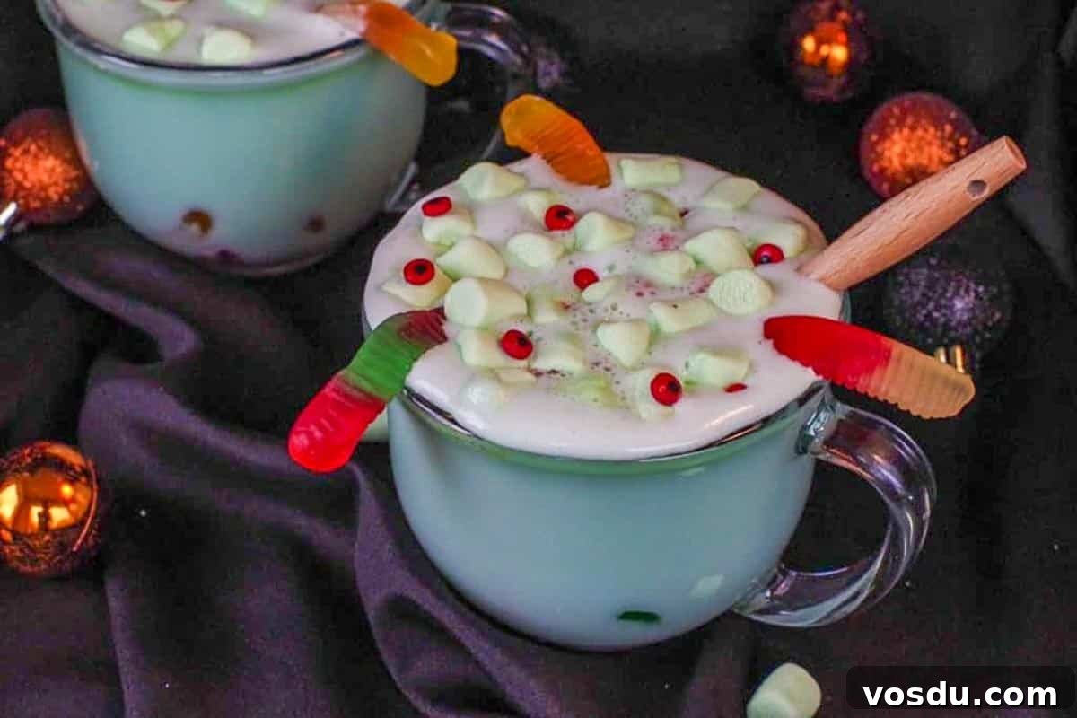 Witches' Brew Halloween Hot Chocolate Recipe for Spooky Nights 2 Halloween hot chocolate in a clear mug with a black background