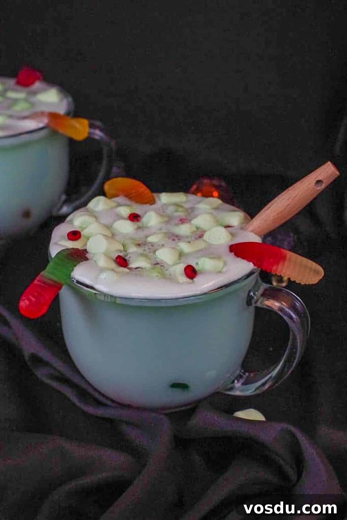Witches' Brew Halloween Hot Chocolate Recipe for Spooky Nights 7 Halloween hot chocolate in a clear mug with a black background