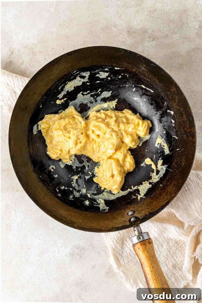 Prawn and Egg Fried Rice Recipe — Quick Weeknight Meal 6 Scrambled egg in a wok.