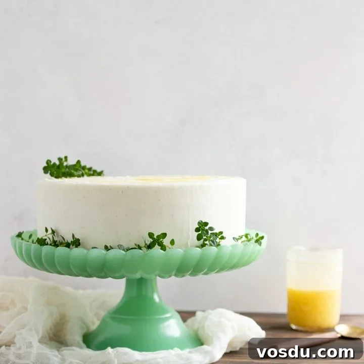 Delight citrus lovers with this triple layer lemon cake from scratch! This tender cake, filled with lemon curd and topped with vanilla icing is one of my most popular from-scratch cake recipes!
