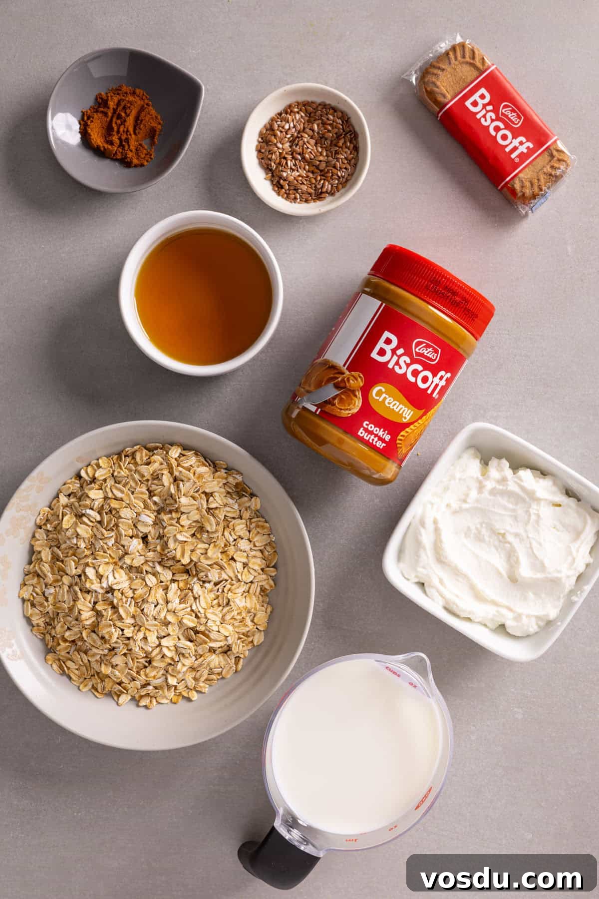 Creamy Biscoff Overnight Oats Recipe for Breakfast Delight 3 Ingredients for Lotus Biscoff overnight oats on a gray table.