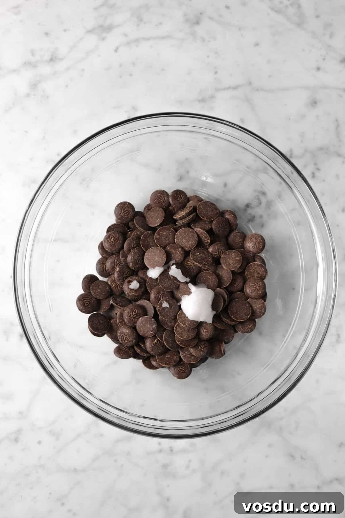 Mickey Mouse Ice Cream Bars: Where to Buy & Nutrition Facts 11 chocolate chips and coconut oil in glass bowl