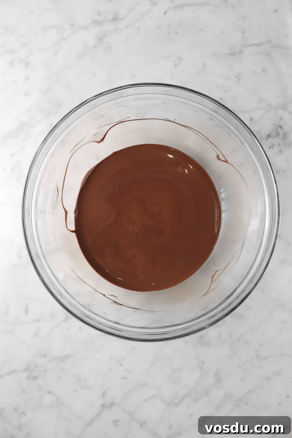 Mickey Mouse Ice Cream Bars: Where to Buy & Nutrition Facts 12 melted chocolate in glass bowl