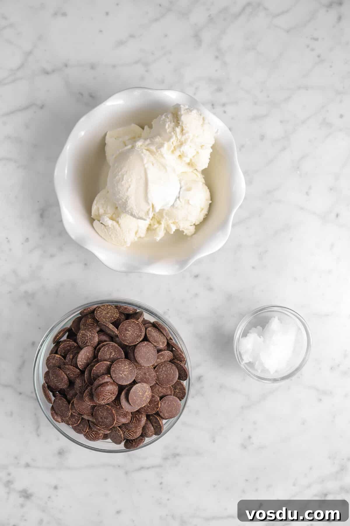 Mickey Mouse Ice Cream Bars: Where to Buy & Nutrition Facts 4 vanilla ice cream, chocolate, and coconut oil on a marble counter