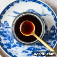 Homemade Yakisoba Sauce: Authentic Japanese Noodle Sauce Recipe 9 Japanese yakisoba sauce in a glass jar placed on a traditional Japanese ceramic plate.