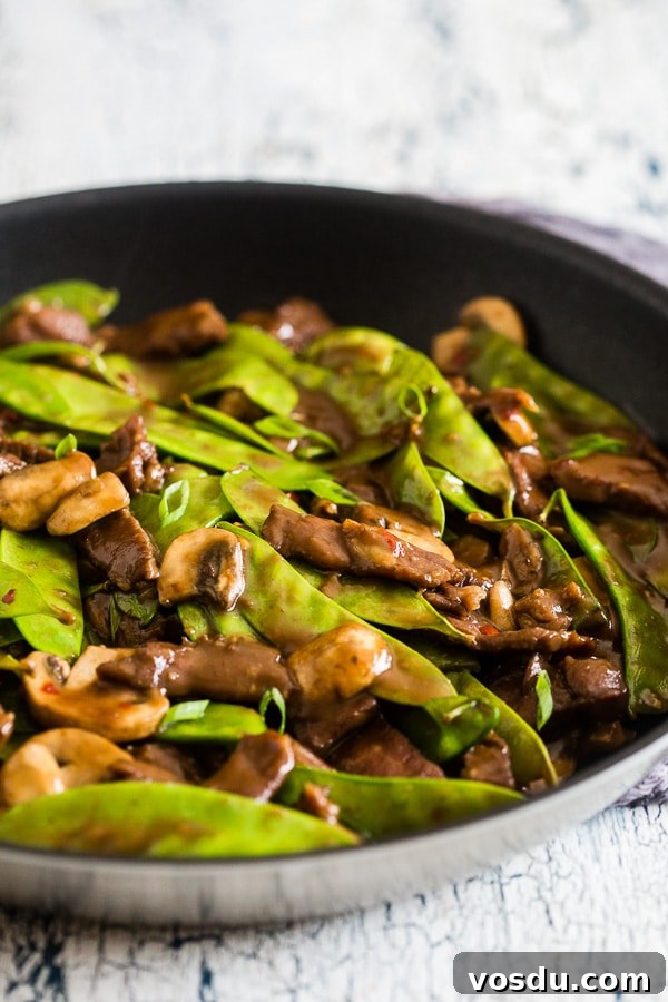 Beef Snow Pea Skillet served on a serving board. 