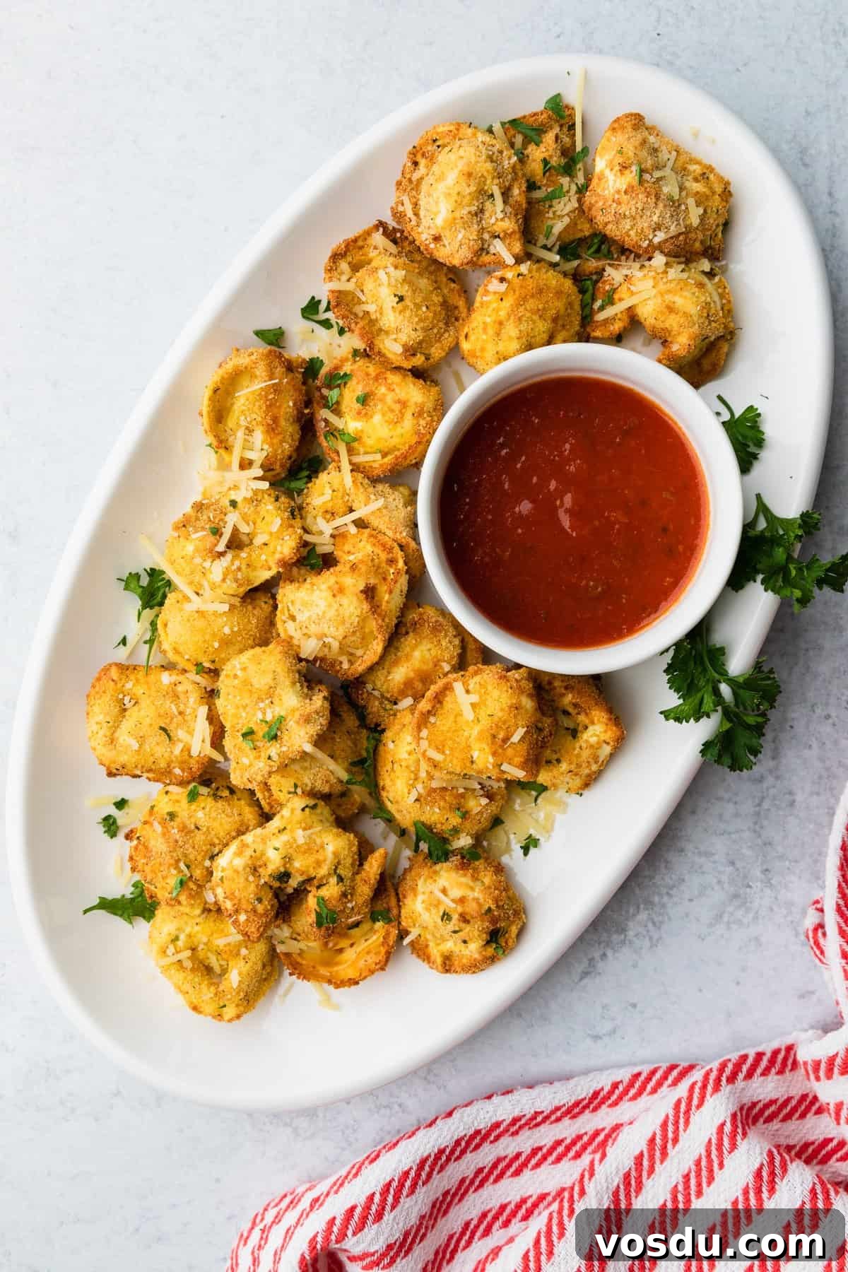 Crispy Air-Fried Tortellini with Garlic Parmesan Dipping Sauce 2 a platter of crispy air fryer tortellini