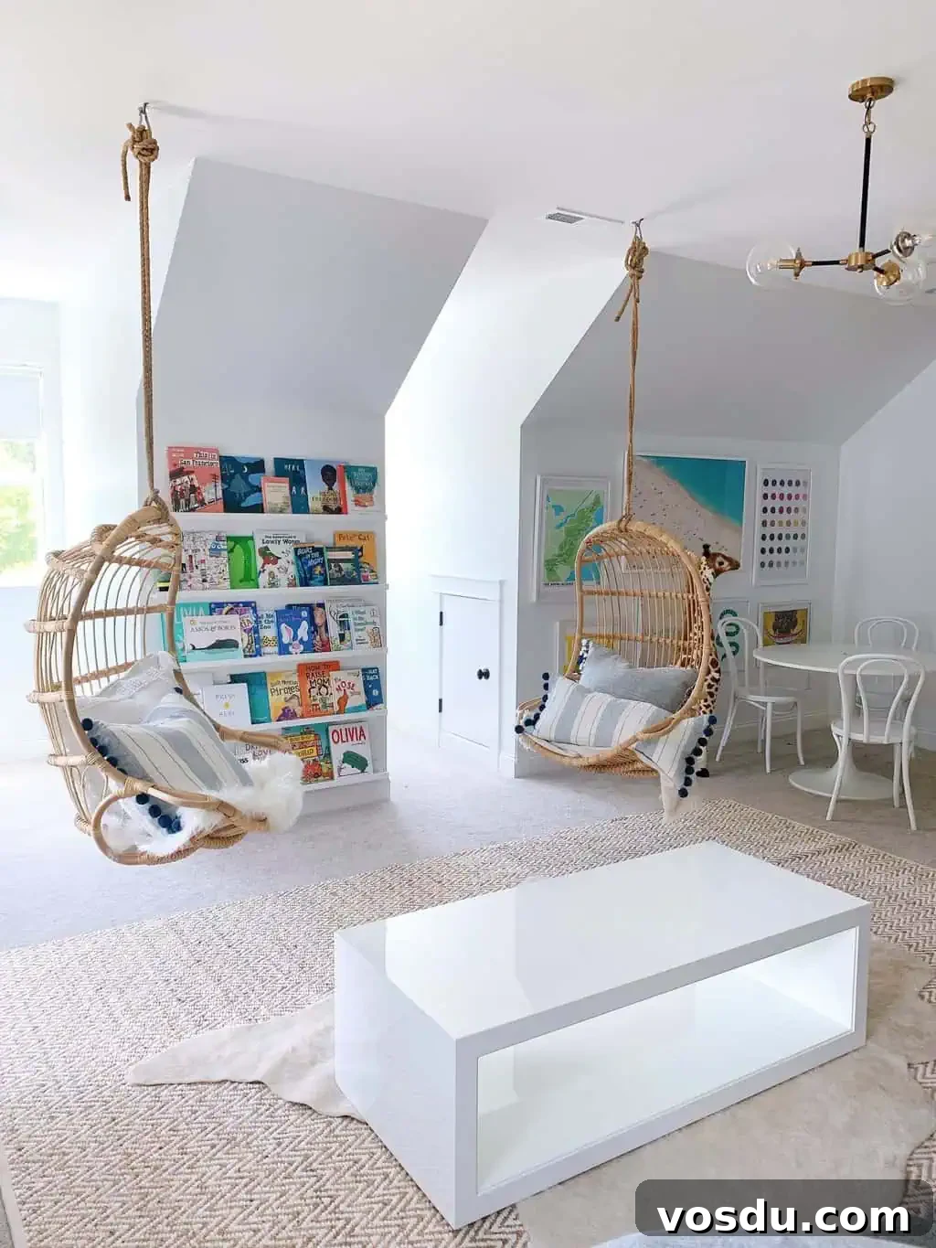 9 Stylish Hanging Rattan Chairs You’ll Love 2 a playroom with colorful books on the walll