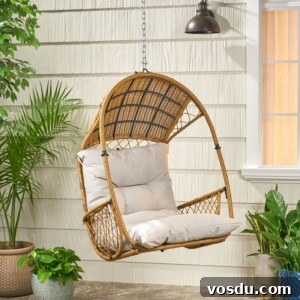 9 Stylish Hanging Rattan Chairs You’ll Love 8 hanging chair on a porch