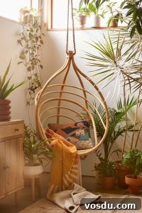 9 Stylish Hanging Rattan Chairs You’ll Love 4 a small swing in a room