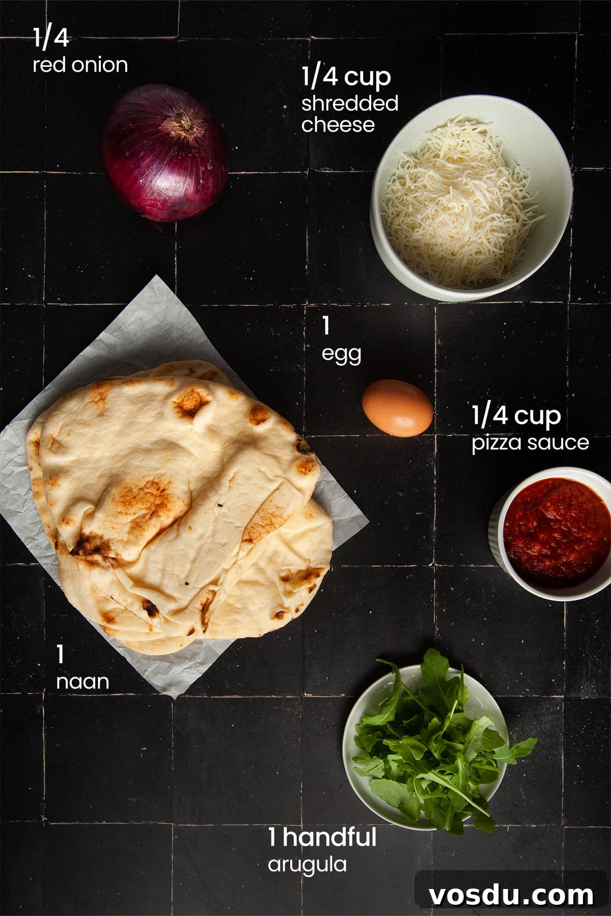 15-Minute Vegetarian Naan Breakfast Pizza Recipe 3 Everything you'll need to make vegetarian naan breakfast pizza including naan bread, marinara sauce, Italian cheese blend, arugula, red onion, and an egg.