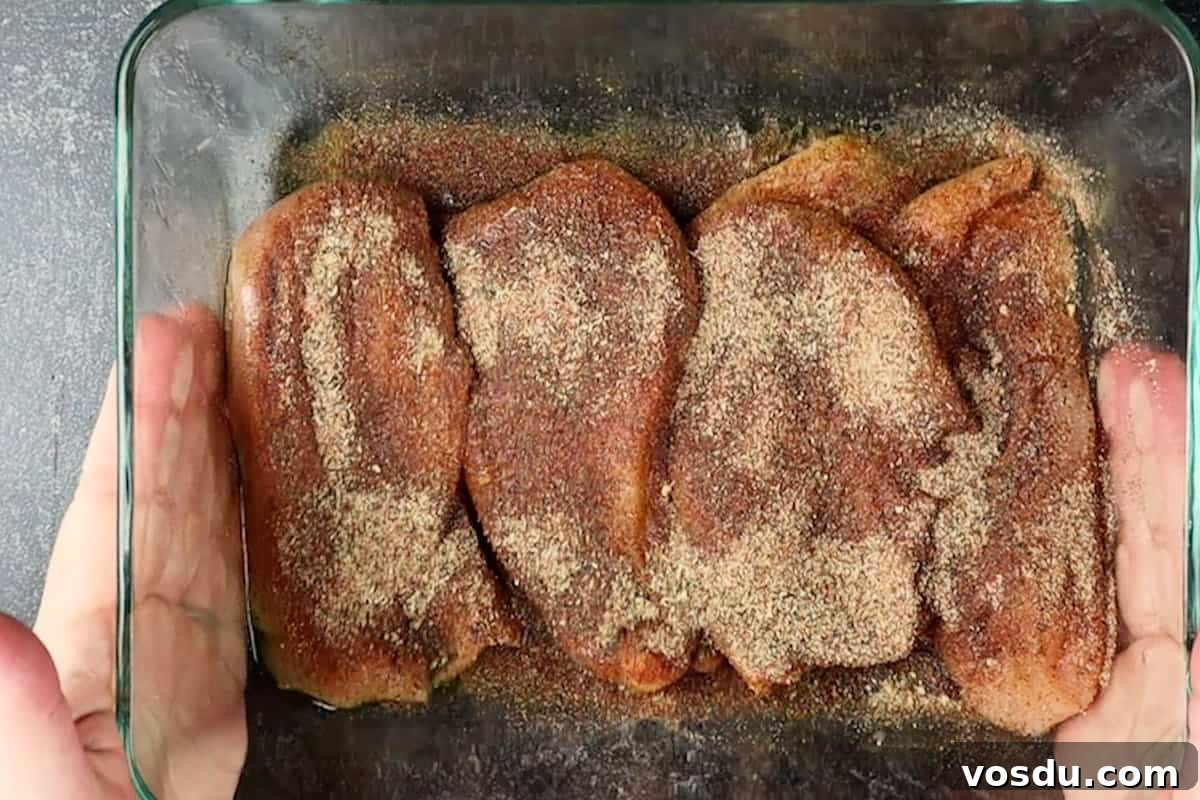Juicy Smoked Chicken Breast Recipe for Tender, Flavorful Results 11 chicken breast with seasoning on it
