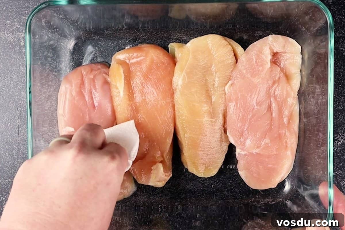 Juicy Smoked Chicken Breast Recipe for Tender, Flavorful Results 9 patting chicken breast dry