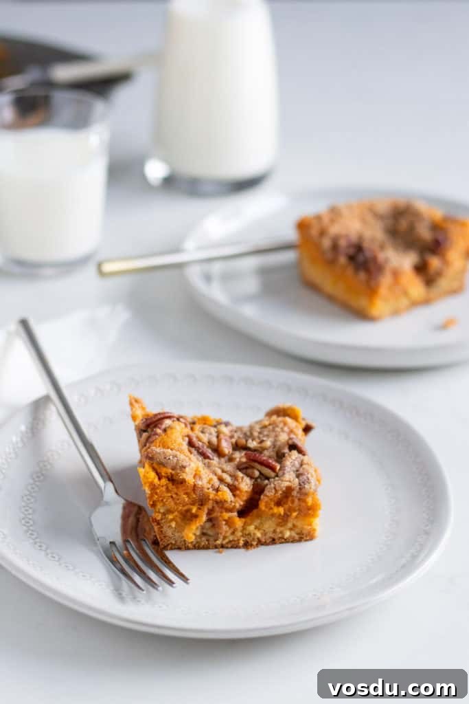 Pumpkin Gooey Butter Cake with Pecan Streusel Recipe 4 gooey butter cake slices on plates with forks