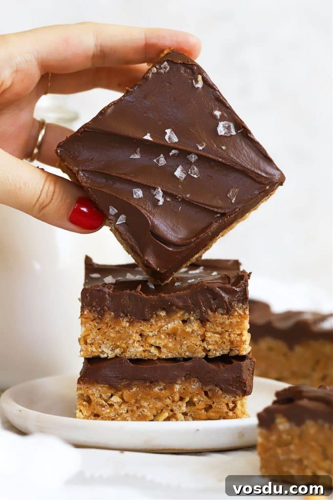 Chocolate Rice Krispie Treats Recipe for Crispy, Chocolatey Squares 9 stacking gluten-free scotcheroos on a white dessert plate