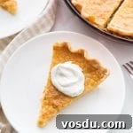 Southern Buttermilk Pie Recipe — Quick, Classic Dessert 7 buttermilk pie plated with pie plate in background
