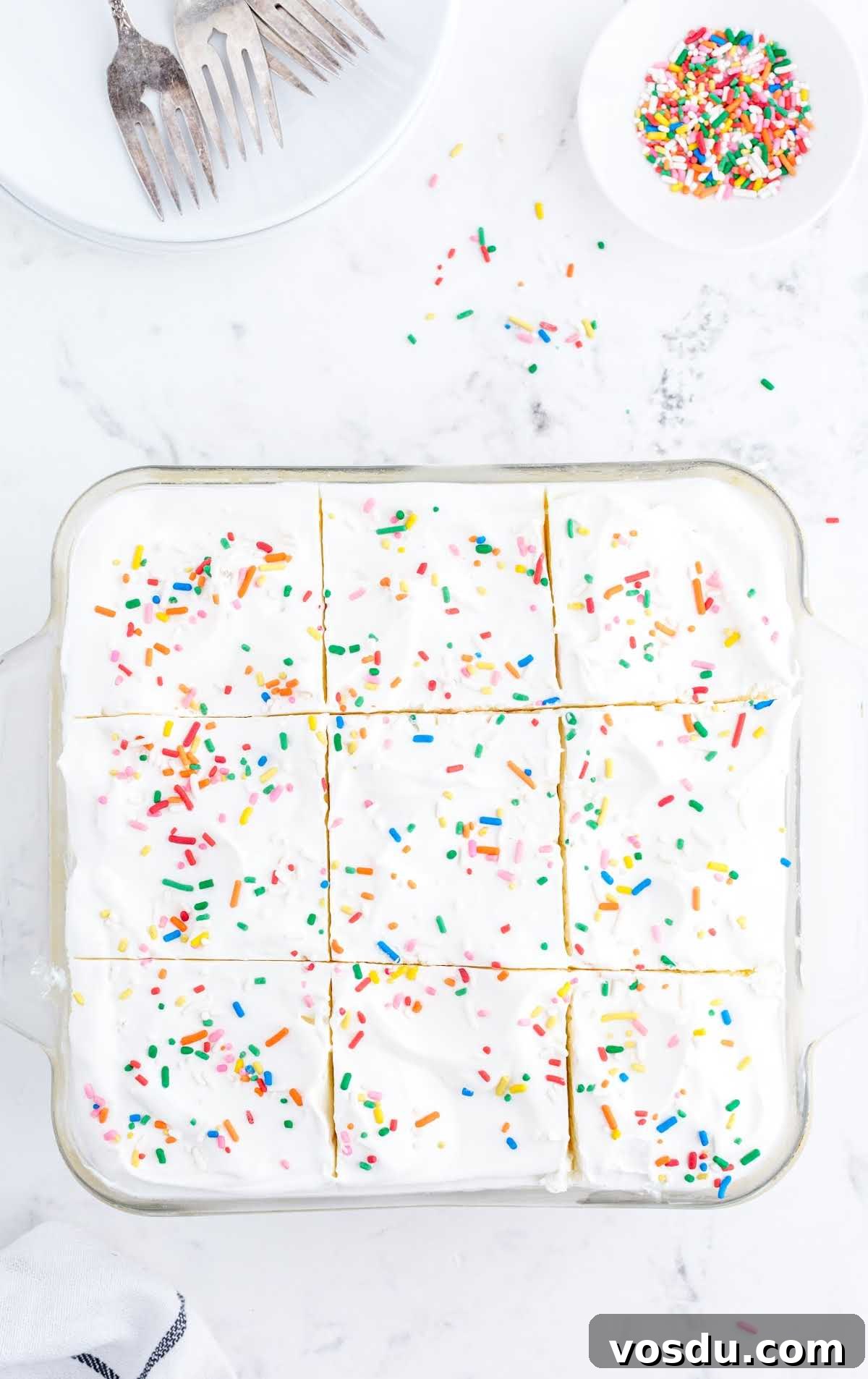 Delicious Birthday Cake Recipes for Every Celebration 8 overhead shot of birthday cake delight with sprinkles on top on a baking dish
