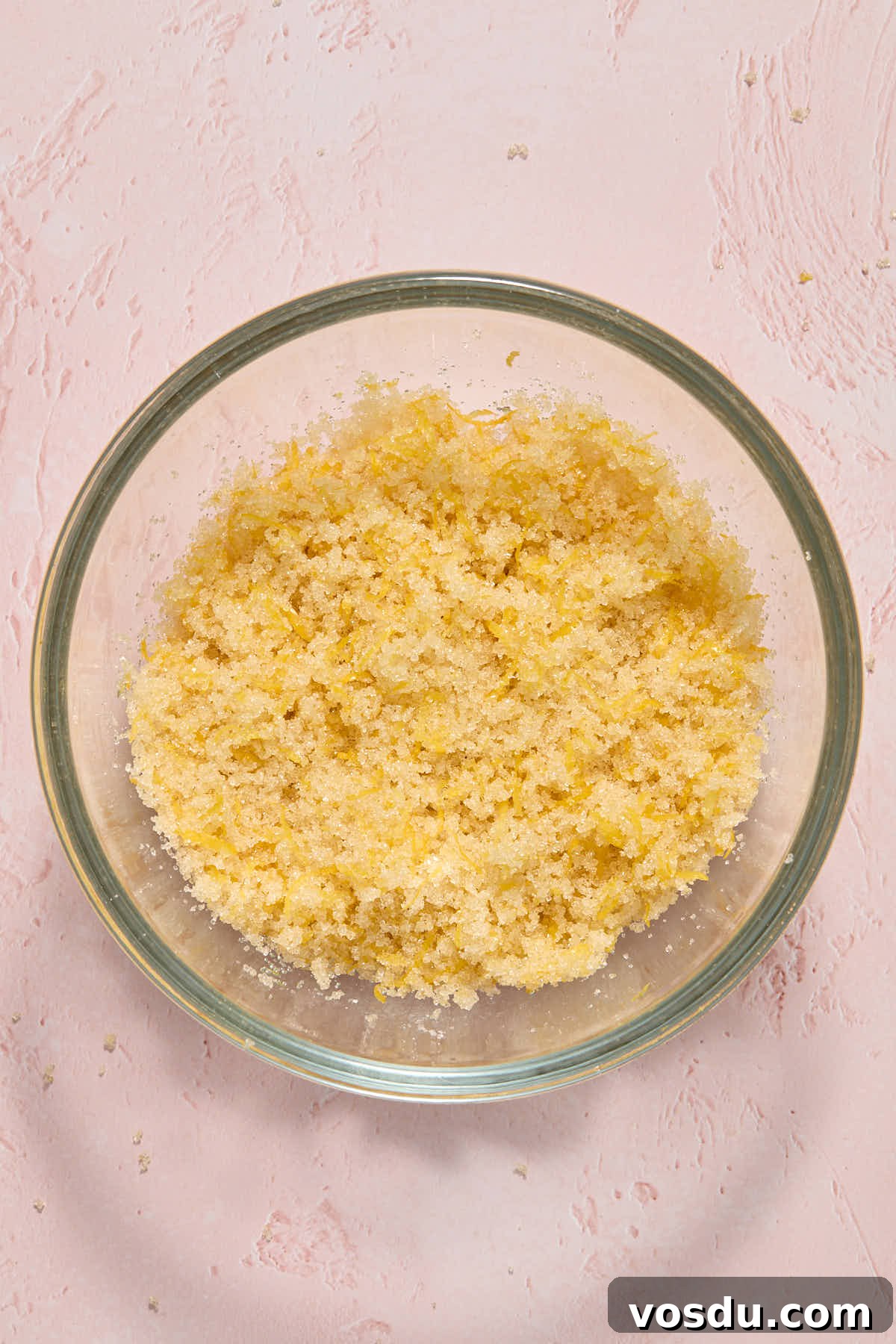 Almond Flour Lemon Poppy Seed Cake Recipe for Moist, Zesty Loaf 6 Lemon zest and sugar rubbed together in a small glass bowl.
