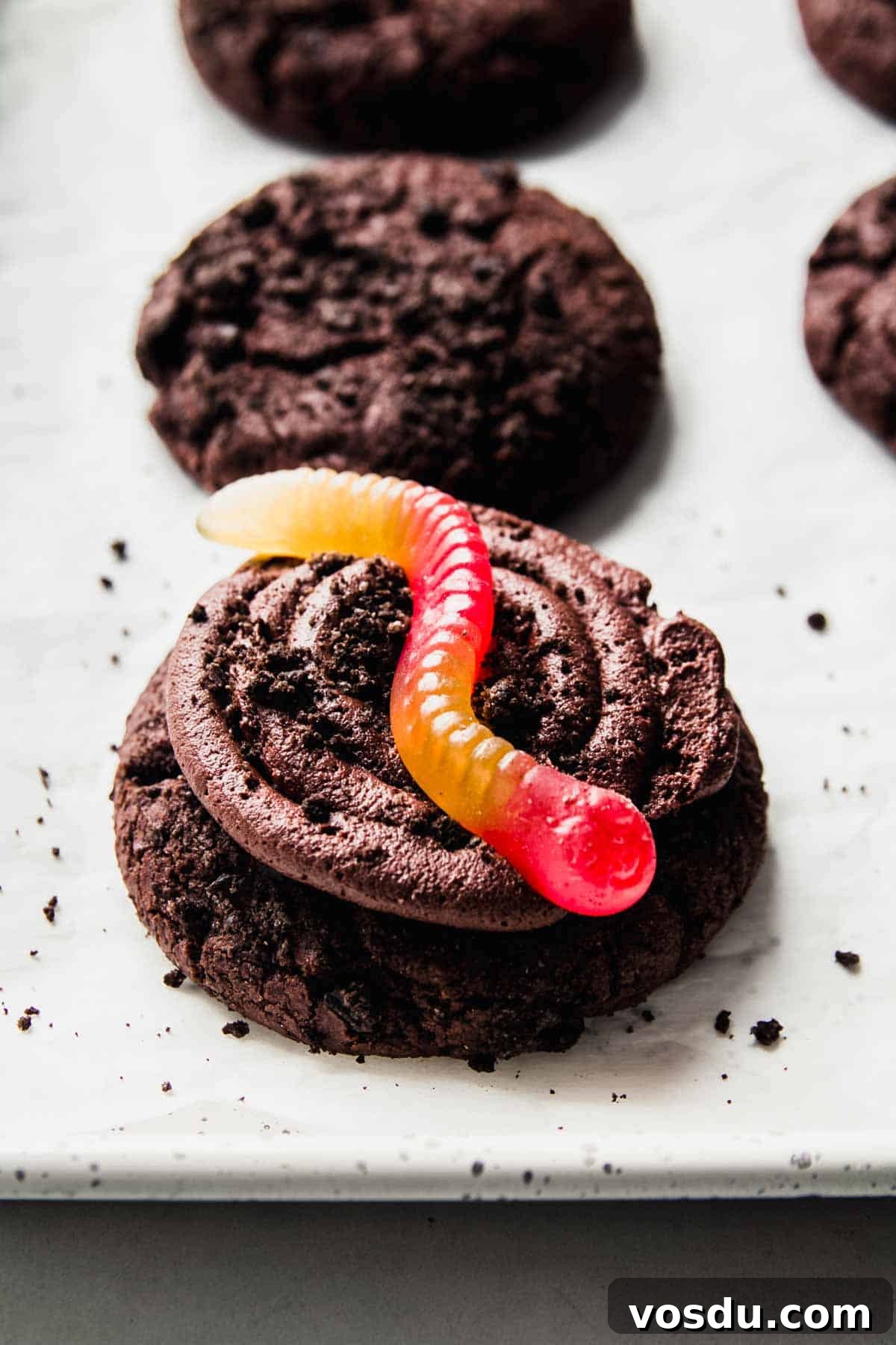 Gluten-Free Crumbl Oreo Dirt Cookies Copycat Recipe 7 Cookie topped with a gummy worm.