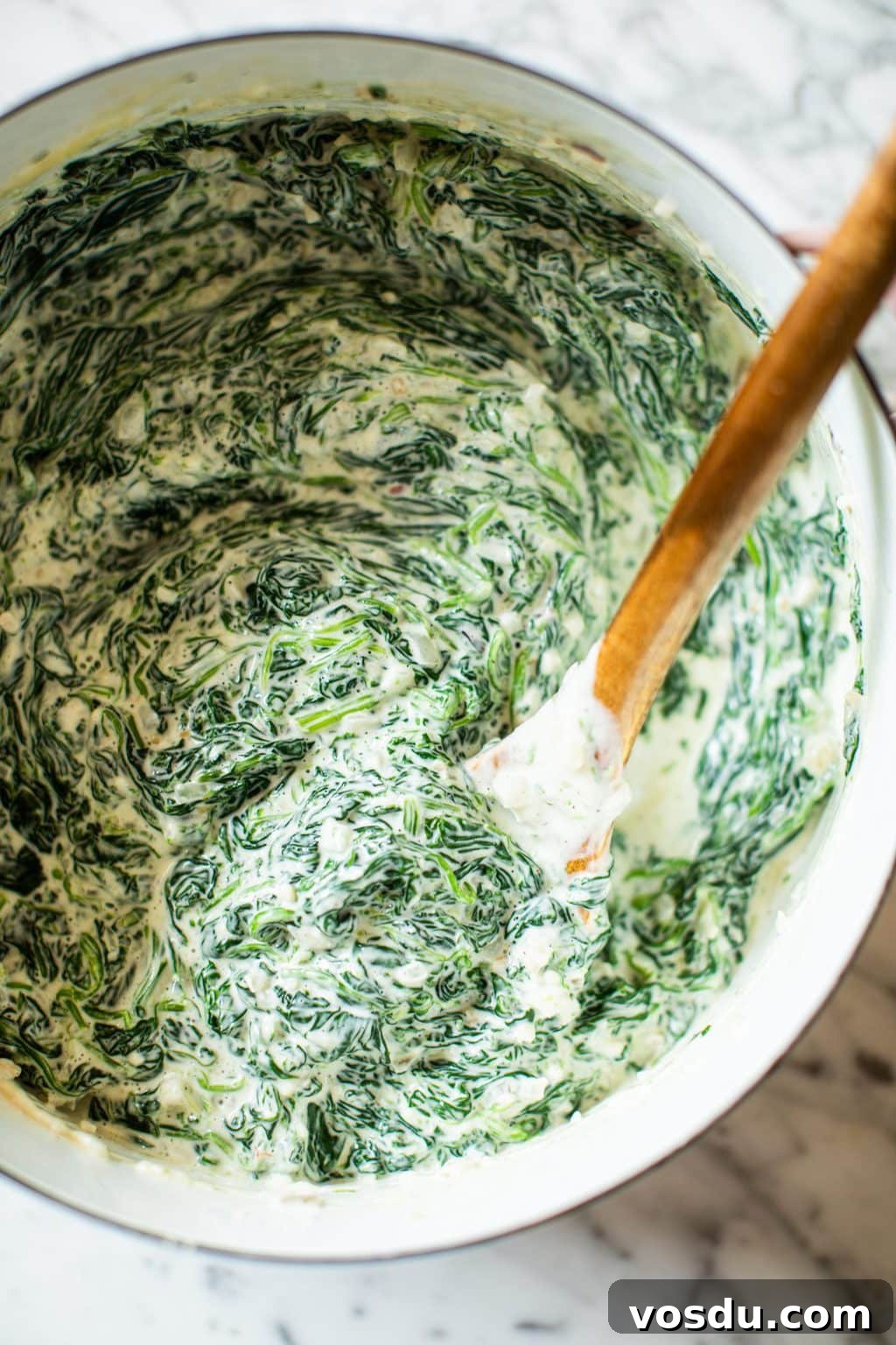 Crispy Topped Creamed Spinach with Crunchy Parmesan Crust 6 creamed spinach in pot with spatula