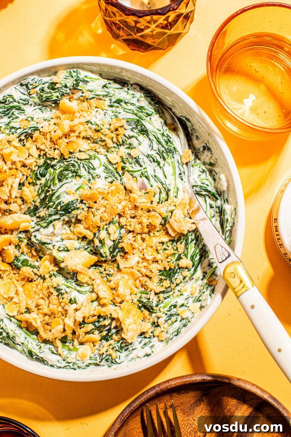 Crispy Topped Creamed Spinach with Crunchy Parmesan Crust 7 best creamed spinach with cracker topping in white bowl with spoon
