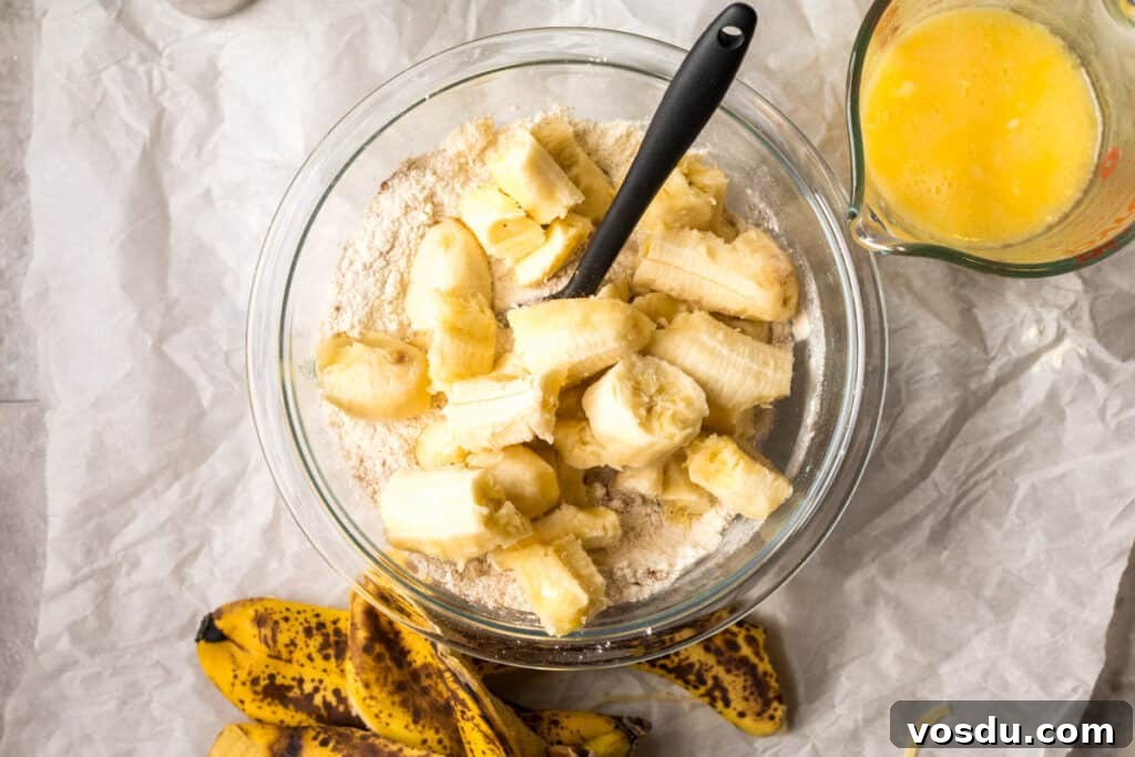 One-Bowl Chocolate Chip Banana Bread Recipe 4 ingredients for banana bread in a glass bowl