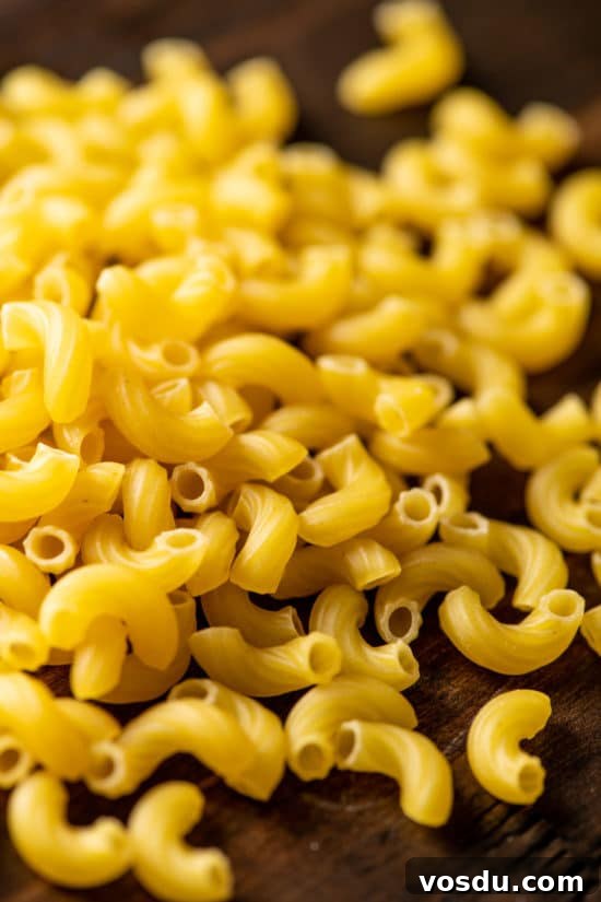10 Essential Pantry Ingredients Every Home Cook Needs 8 Uncooked pasta noodles on a table.