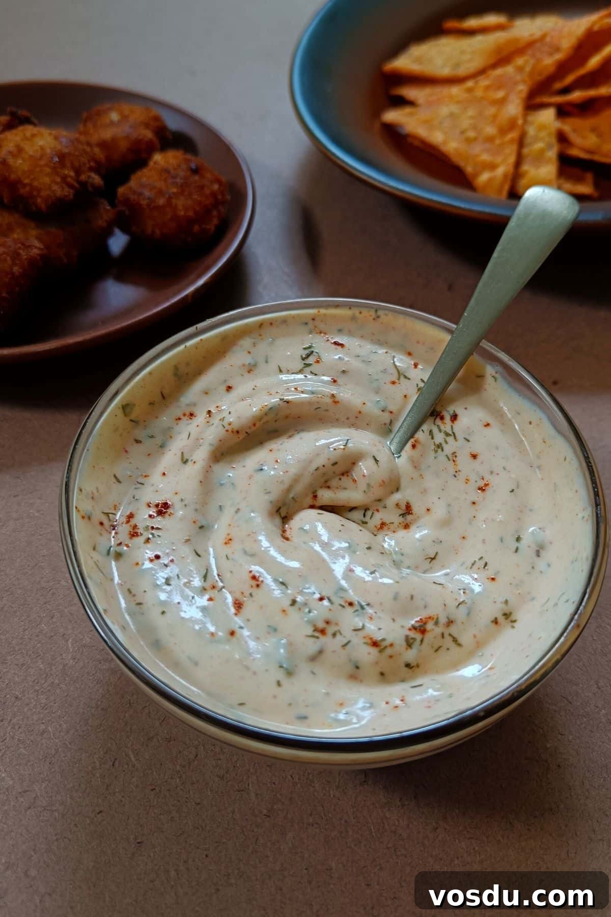 Copycat Popeyes Blackened Ranch Dressing Recipe 5 Image showing blackened ranch sauce served with snacks.