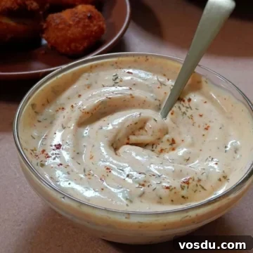 Blackened ranch sauce in a glass bowl.