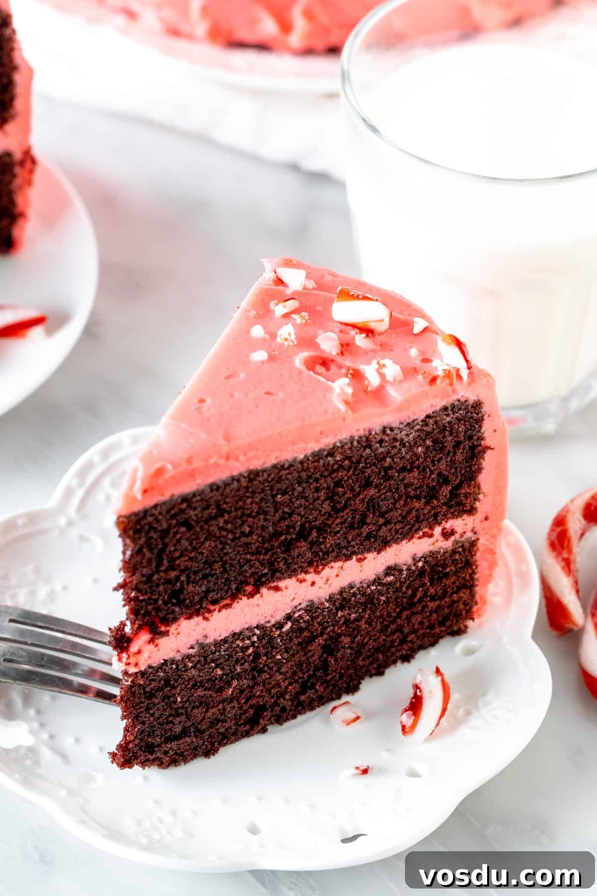 Chocolate Candy Cane Layer Cake with Peppermint Frosting 2 Slice of chocolate peppermint cake with a glass of milk