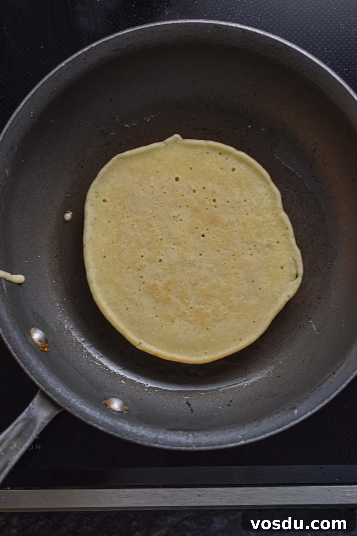 Fluffy Dairy-Free Pancakes Recipe for Breakfast and Brunch 9 The pancake is flipped.