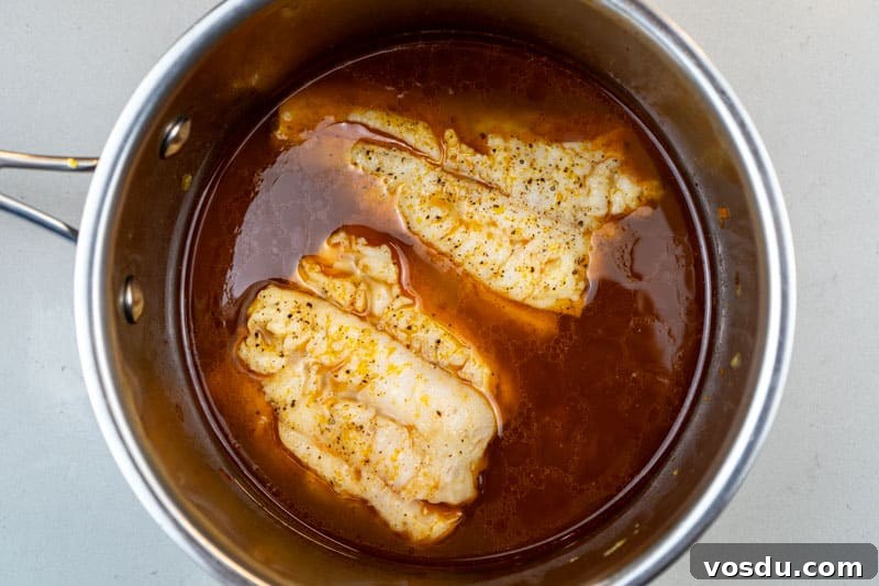 Sicilian Couscous alla Trapanese: Authentic Trapani Recipe 7 Poaching the fish