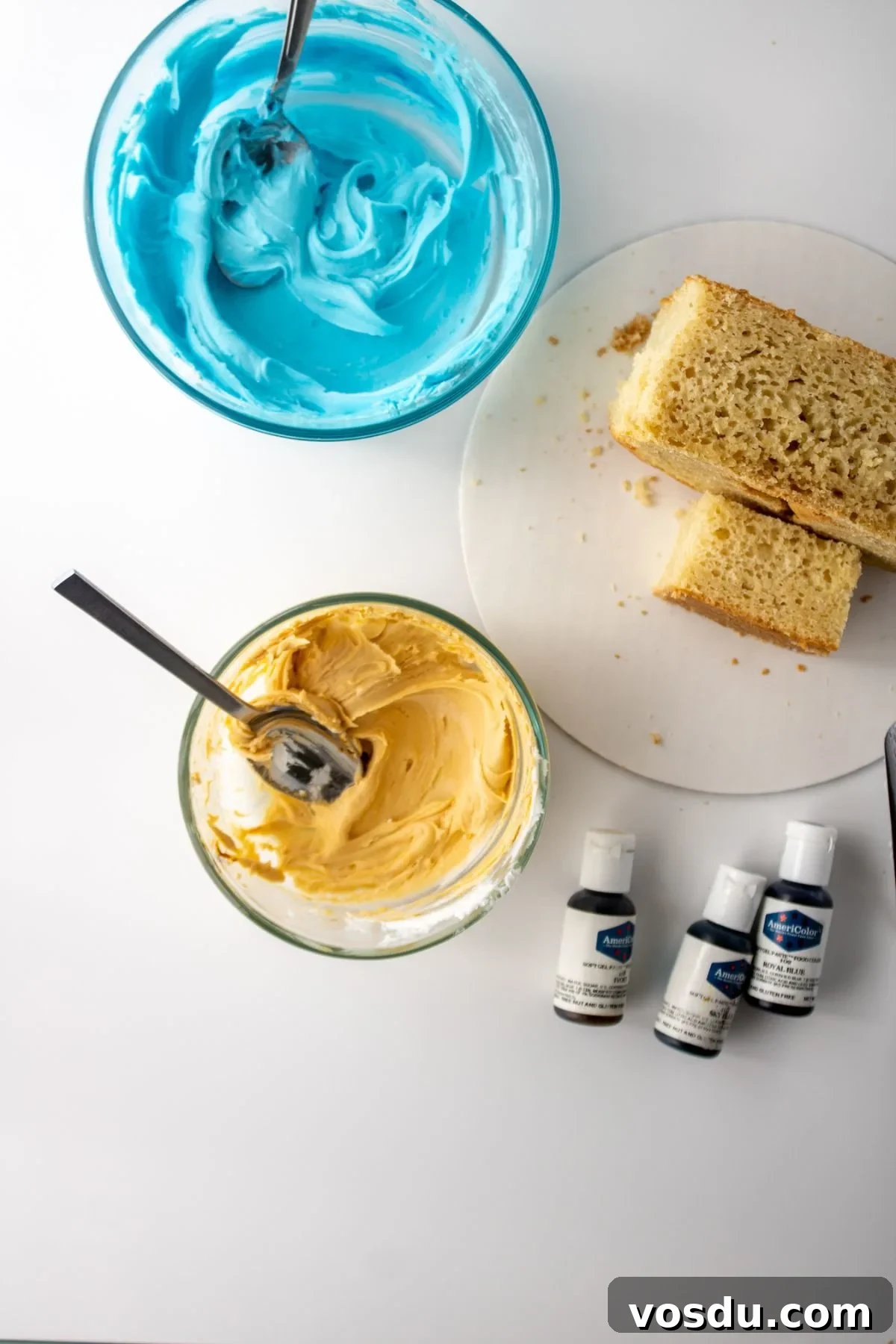Bluey Cake Recipe with Simple Step-by-Step Tutorial 10 Buttercream frosting in different colors with food gel color.