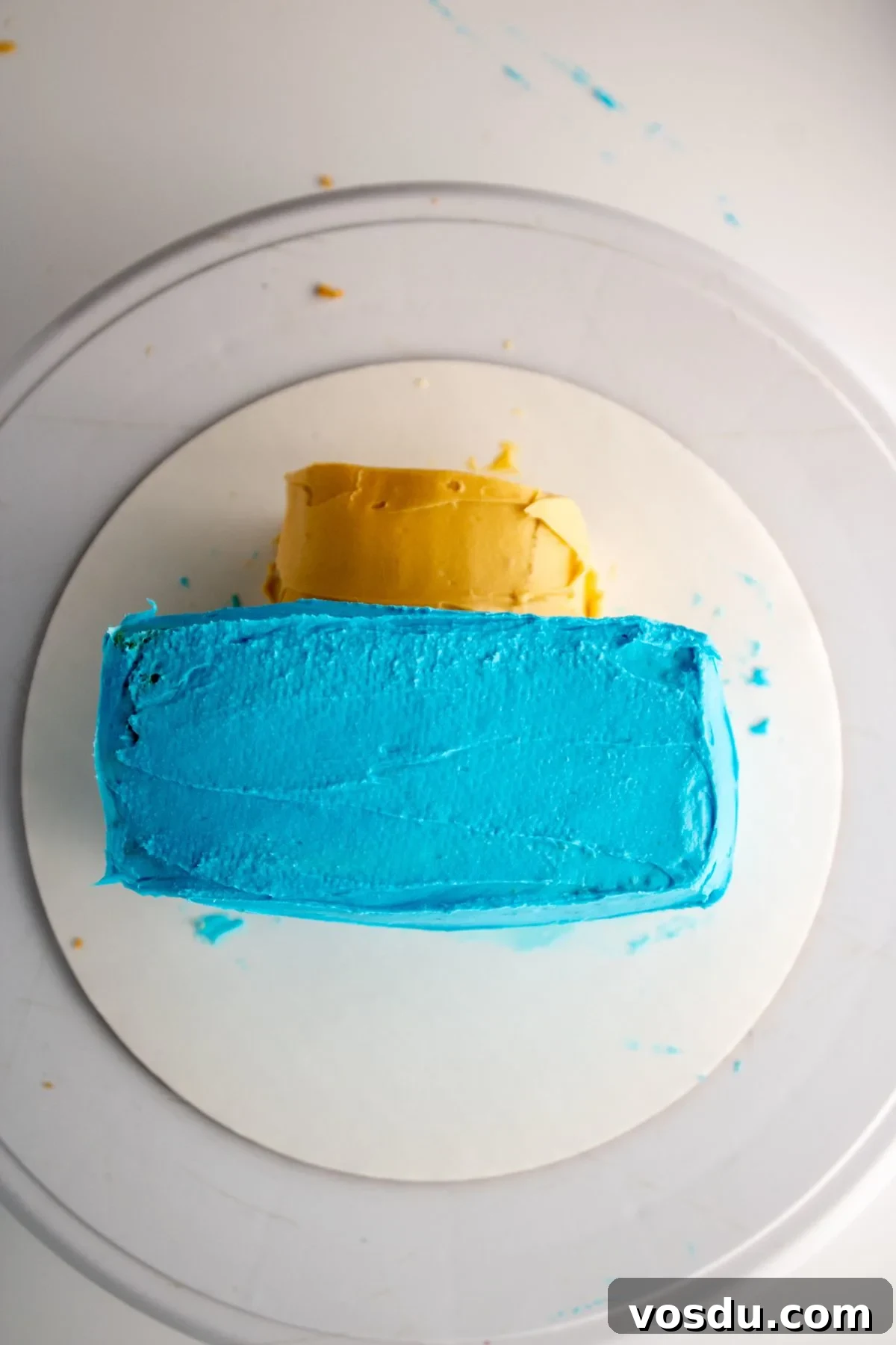 Bluey Cake Recipe with Simple Step-by-Step Tutorial 13 An ivory colored nose piece added to the front of Bluey's head.