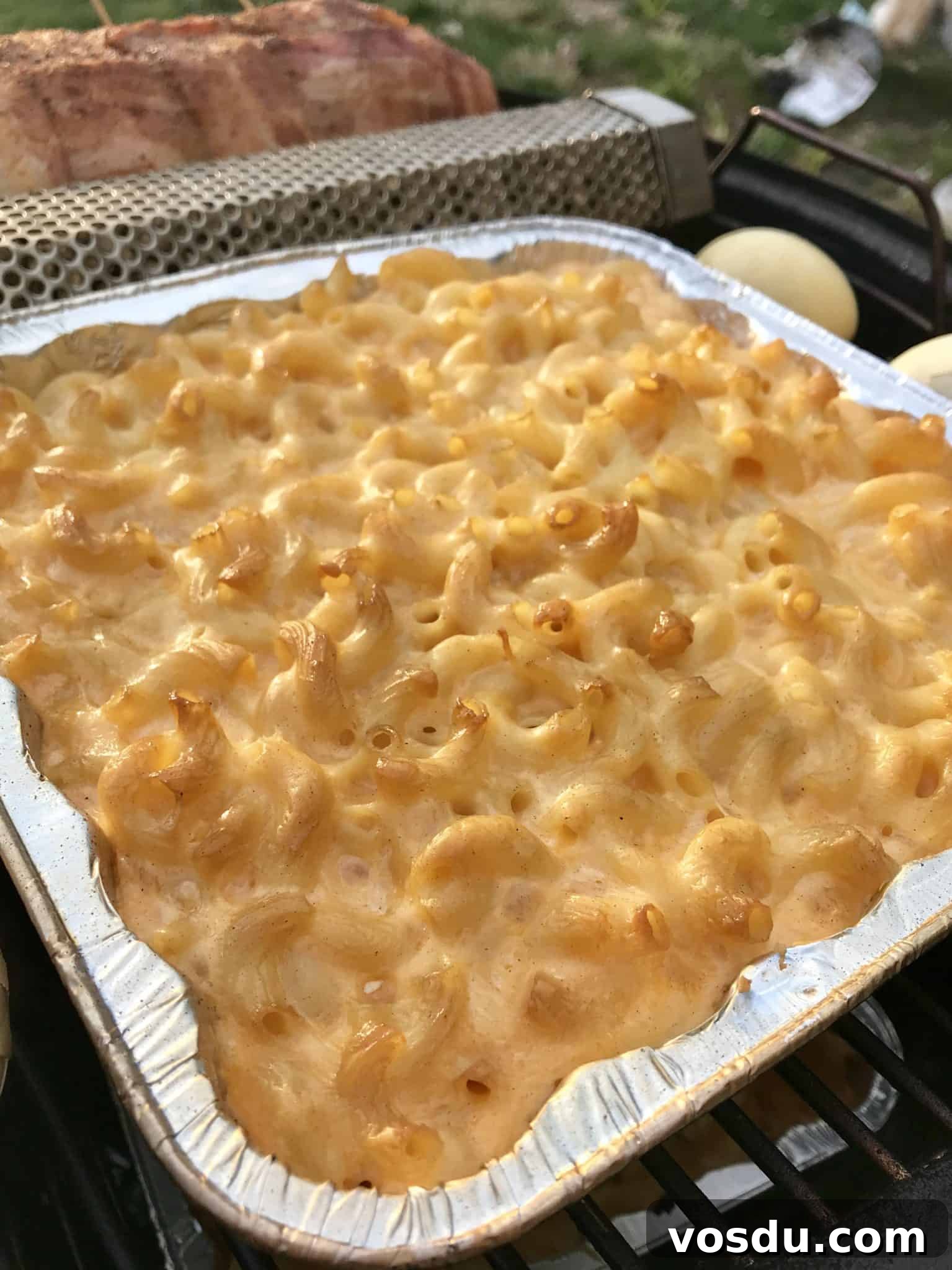 Smoked Macaroni and Cheese Recipe – Creamy, Smoky Comfort Food 3 close up view of Smoked Mac and cheese in foil pan on smoker