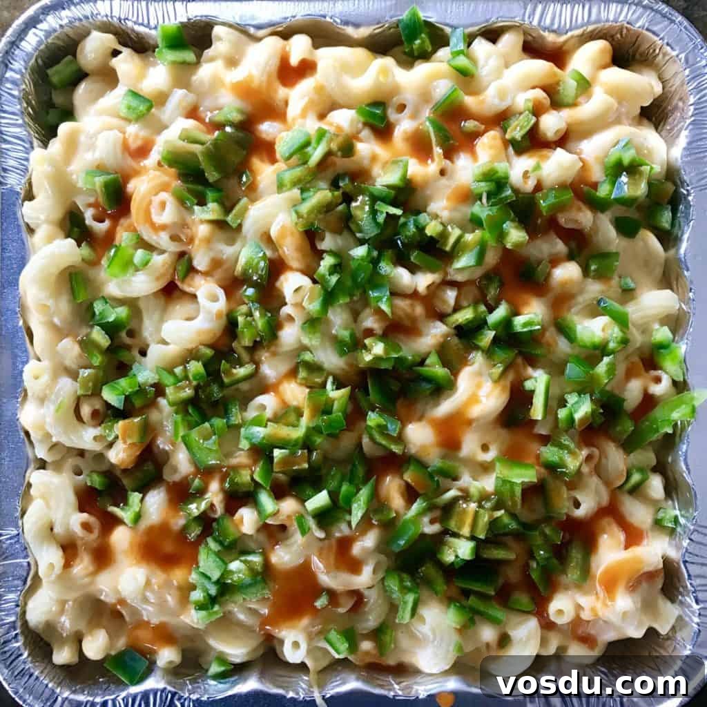 Smoked Macaroni and Cheese Recipe – Creamy, Smoky Comfort Food 6 Smoked Mac and cheese topped with hot sauce and jalapeños