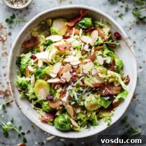 Shaved brussel sprout salad with bacon and vinaigrette.
