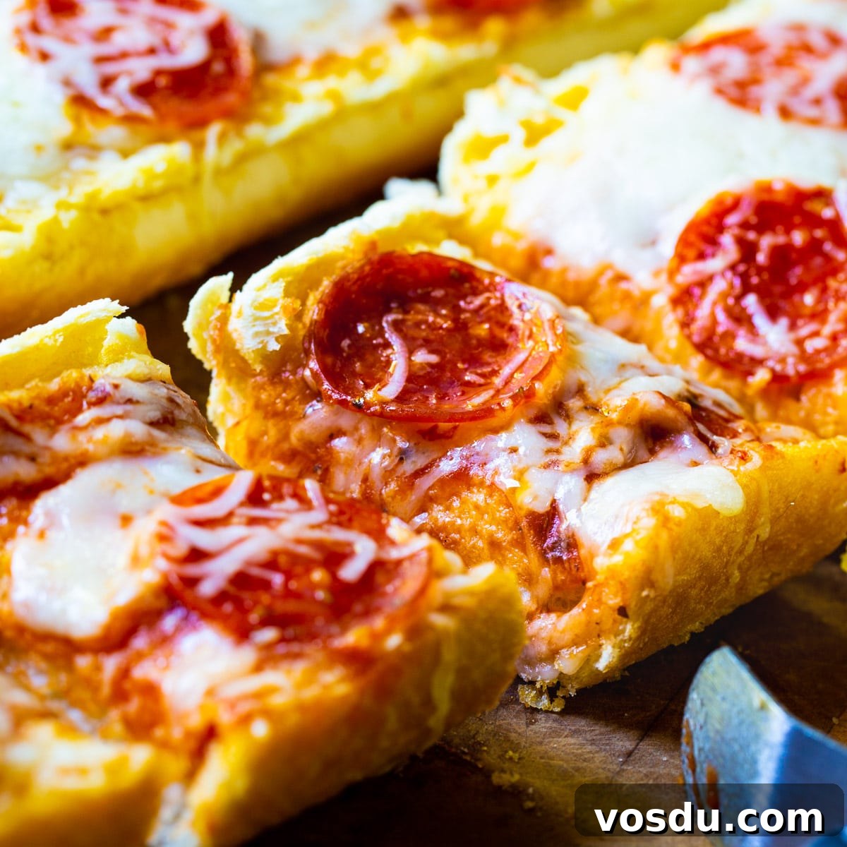 Garlic Bread Pizza: Crispy Cheesy Pizza with Garlic Butter Crust 2 Garlic Bread Pizza cut into slices.