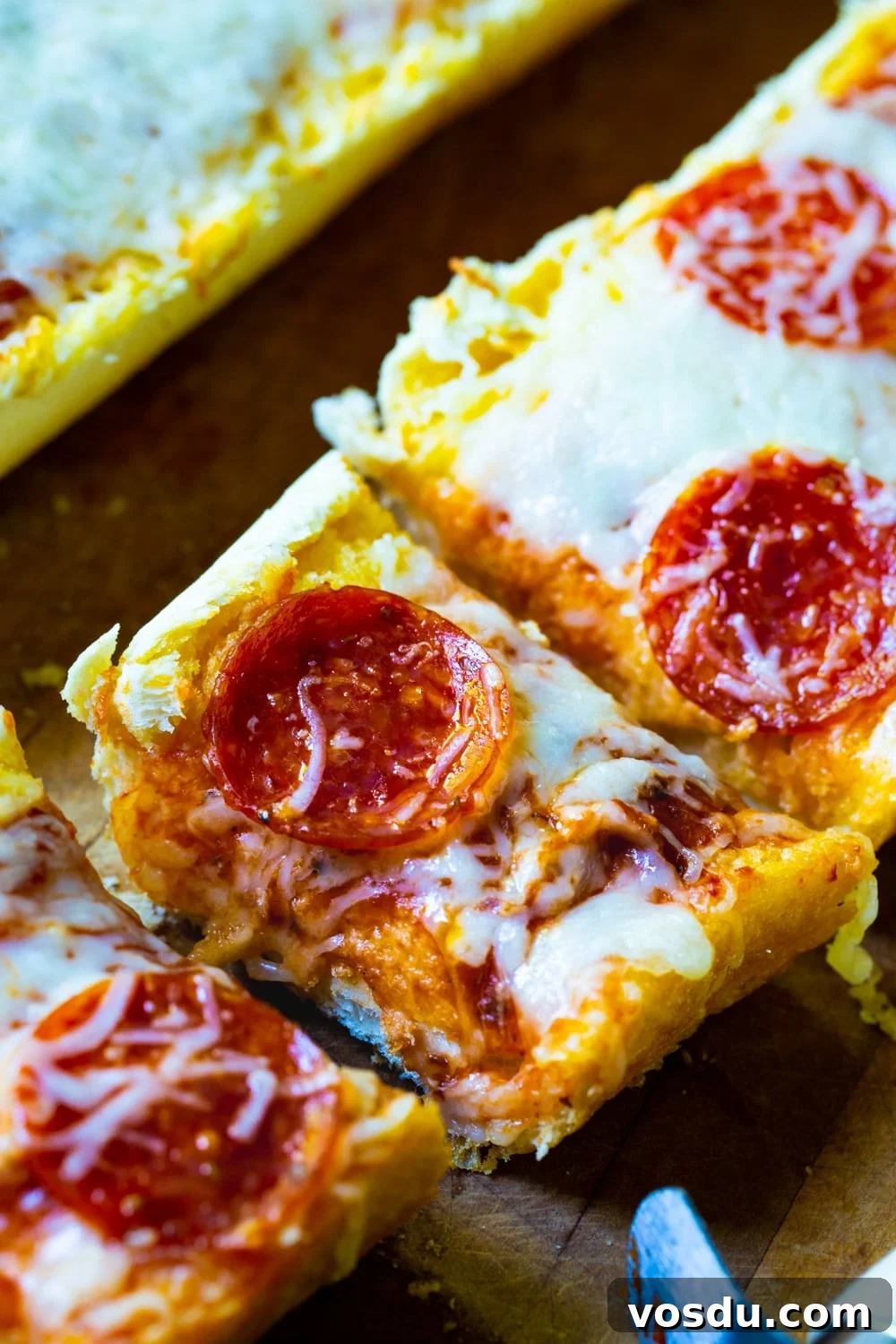 Garlic Bread Pizza: Crispy Cheesy Pizza with Garlic Butter Crust 4 Garlic Bread Pizza cut into slices.