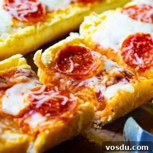 Garlic Bread Pizza: Crispy Cheesy Pizza with Garlic Butter Crust 5 Garlic Bread Pizza cut into slices.