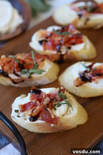 Crostini topped with goat cheese, prosciutto and sage.