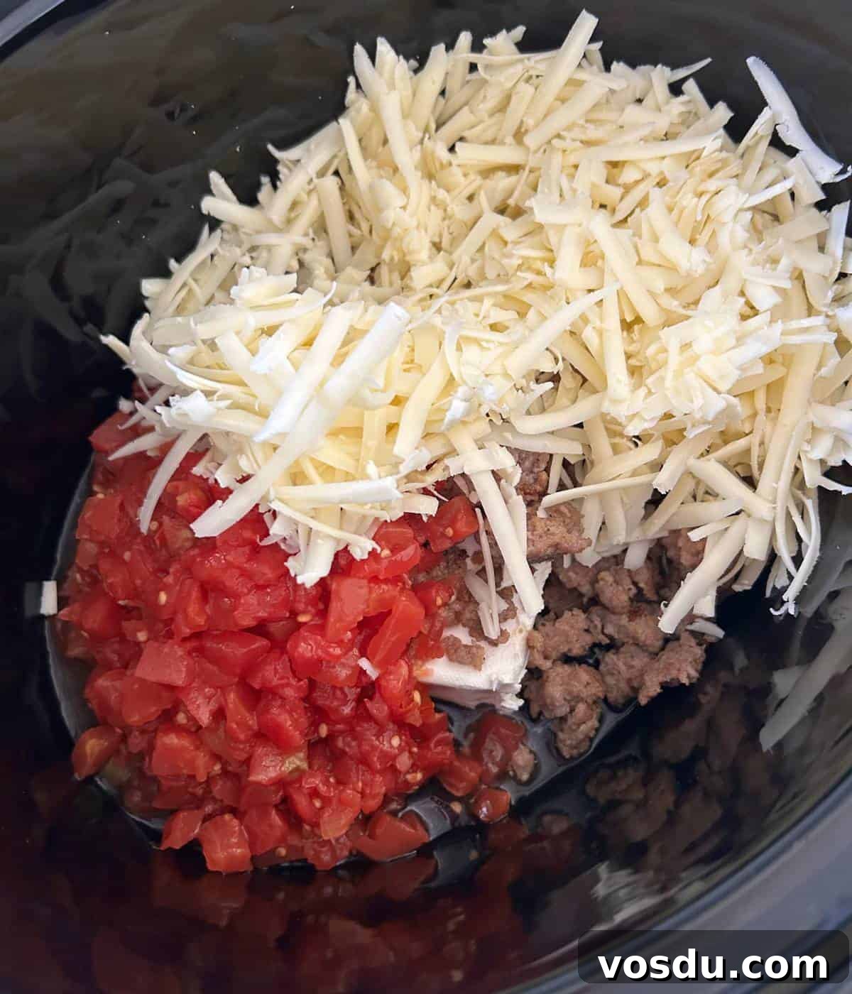 Creamy Rotel Sausage Dip (Slow Cooker Recipe) 5 Rotel dip ingredients in slow cooker.