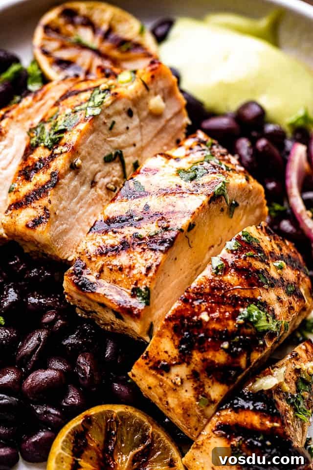 Citrus Mojo Grilled Chicken Recipe — Zesty Caribbean Flavor 2 Sliced grilled chicken breast set over black beans