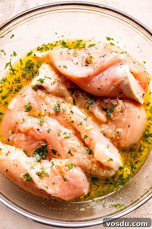 Citrus Mojo Grilled Chicken Recipe — Zesty Caribbean Flavor 3 marinating chicken breasts in orange juice