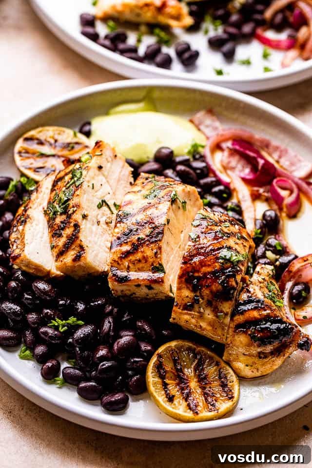 Citrus Mojo Grilled Chicken Recipe — Zesty Caribbean Flavor 5 Grilled Mojo Chicken Breast cut in slices and served over black beans and guacamole to the side.
