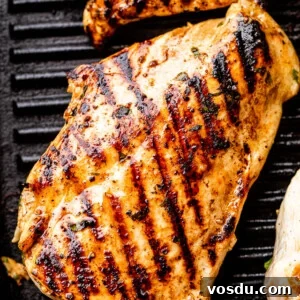 Citrus Mojo Grilled Chicken Recipe — Zesty Caribbean Flavor 7 chicken breast with grill marks set on a black grill pan