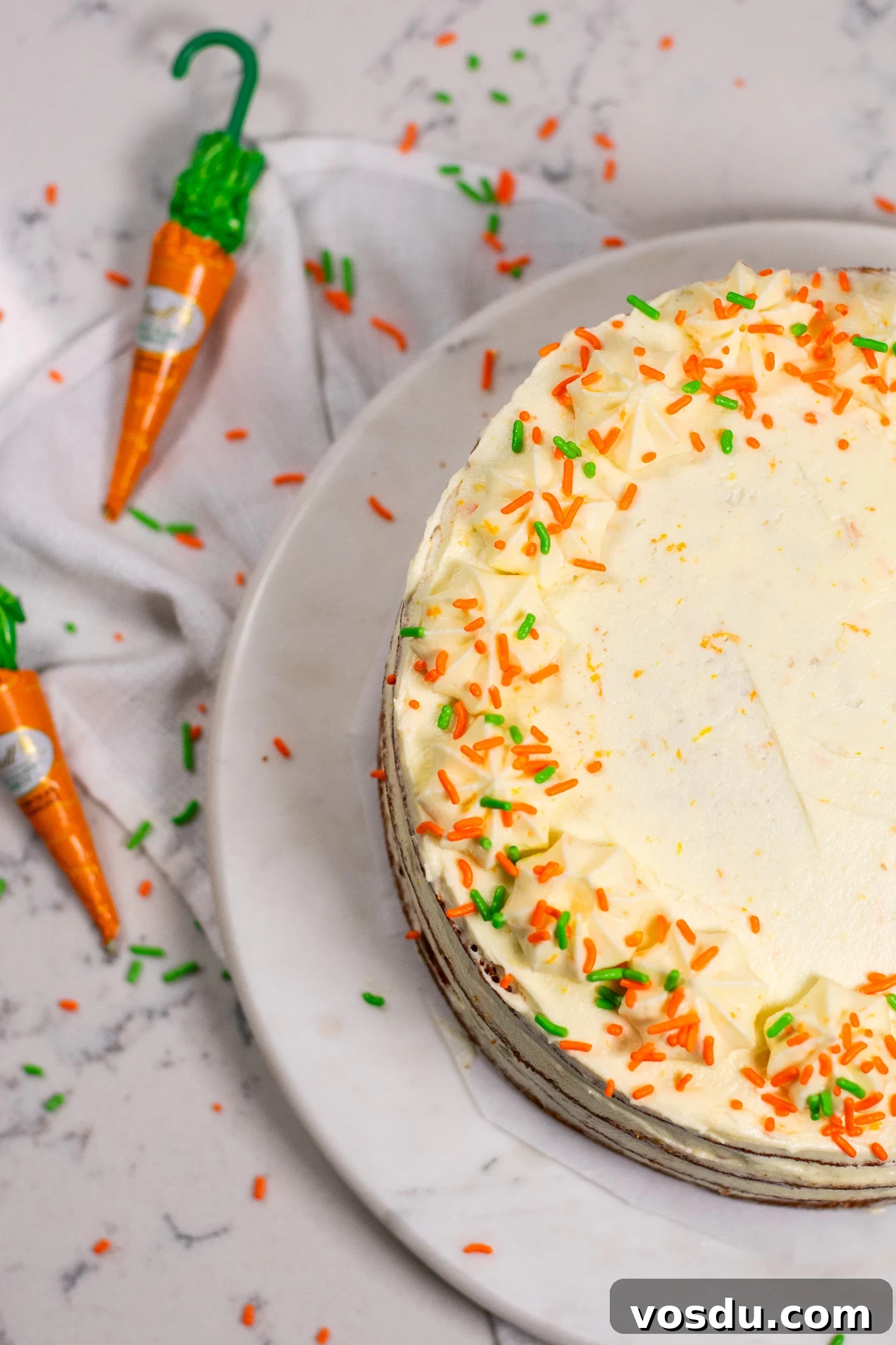 Classic Danish Carrot Cake Recipe with Cream Cheese Frosting 3 A carrot cake with icing.